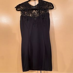 Club L black bodycon mini dress with crochet lace collar/shoulders. Size 10 US.